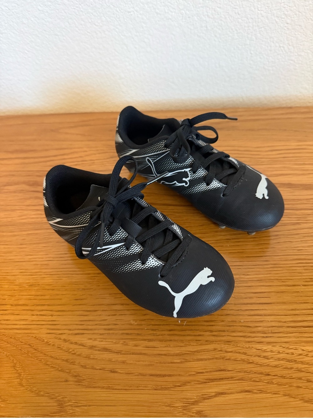 Puma Black Kids' Soccer Cleats with White Puma Logo